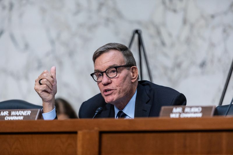 © Reuters. Chairman Mark Warner (D-VA) speaks on the day Google parent Alphabet's global affairs president Kent Walker, Meta's global affairs president Nick Clegg and Microsoft President Brad Smith testify before a Senate Intelligence Committee hearing on election threats, on Capitol Hill in Washington, U.S., September 18, 2024. REUTERS/Anna Rose Layden/File Photo