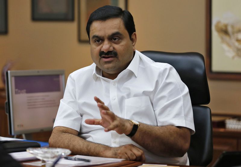 © Reuters. FILE PHOTO: Indian billionaire Gautam Adani speaks during an interview with Reuters at his office in the western Indian city of Ahmedabad April 2, 2014.  REUTERS/Amit Dave/File Photo