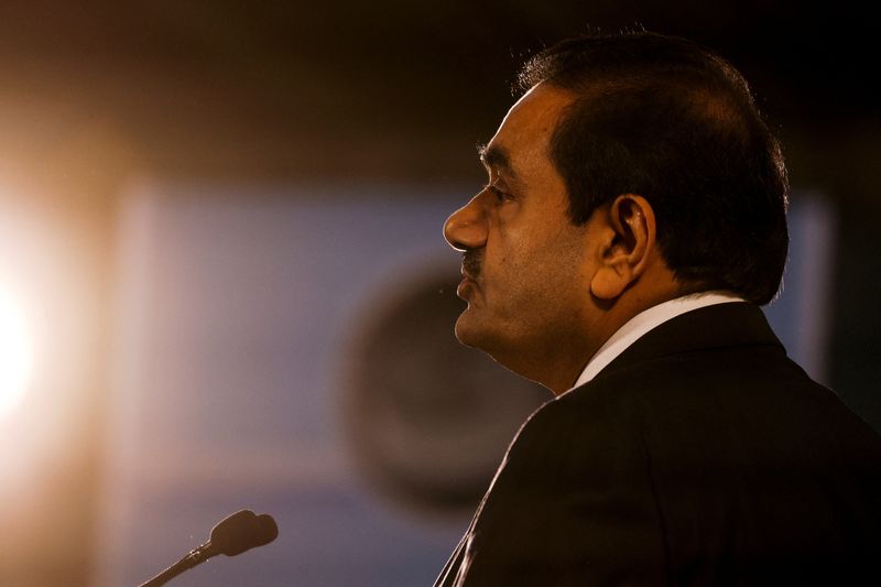 © Reuters. FILE PHOTO: Indian billionaire Gautam Adani speaks during an inauguration ceremony after the Adani Group completed the purchase of Haifa Port earlier in January 2023, in Haifa port, Israel January 31, 2023. REUTERS/Amir Cohen/File Photo