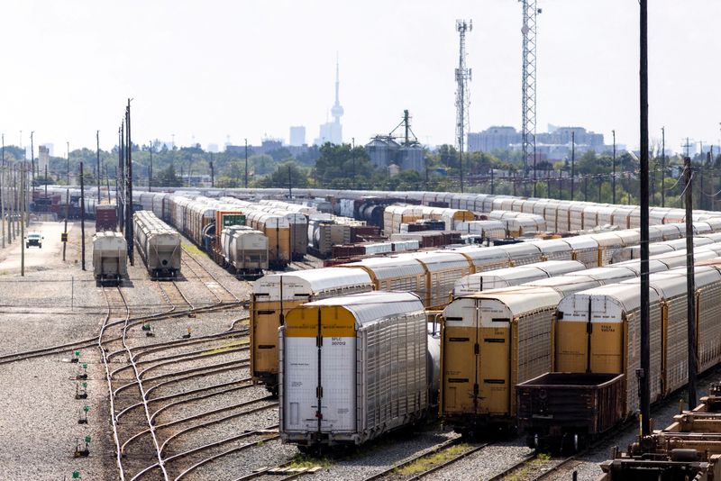 © Reuters. FILE PHOTO: Containers are stacked at the CPKC Toronto yard, after Canadian National Railway (CN) and Canadian Pacific Kansas City (CPKC) locked out workers following unsuccessful negotiation attempts with the Teamsters union, in Toronto, Ontario, Canada August 22, 2024. REUTERS/Carlos Osorio/File Photo