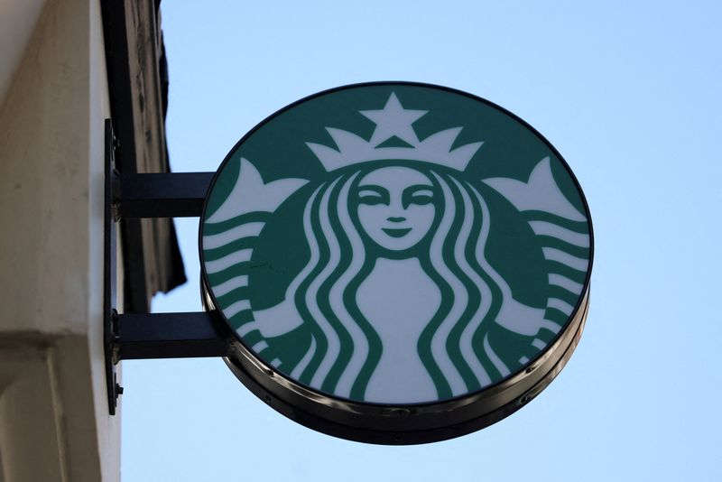 © Reuters. FILE PHOTO: Starbucks logo is displayed above their cafe in London, Britain, August 13, 2024. REUTERS/Hollie Adams/ File Photo