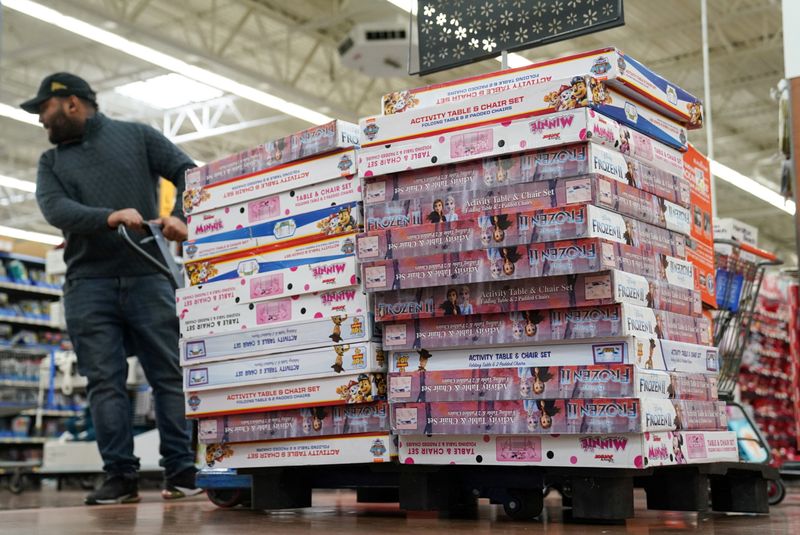 © Reuters. FILE PHOTO: A Walmart employee stocks the toy section of Walmart on Black Friday, a day that kicks off the holiday shopping season, in King of Prussia, Pennsylvania, U.S., on November 29, 2019. REUTERS/Sarah Silbiger/File Photo