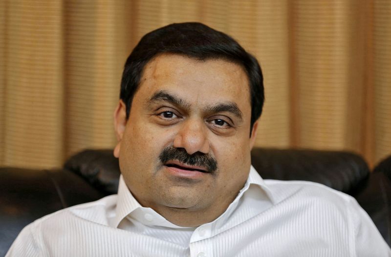 © Reuters. FILE PHOTO: Indian billionaire Gautam Adani speaks during an interview with Reuters at his office in the western Indian city of Ahmedabad in this April 2, 2014 file photo. REUTERS/Amit Dave/File Photo