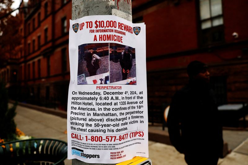 © Reuters. An NYPD information poster hangs outside the New York International Hostel, where the suspect in the fatal shooting of CEO of UnitedHealthcare Brian Thompson is believed to have stayed, in the Upper West Side area of New York City, U.S., December 5, 2024. REUTERS/Shannon Stapleton/File Photo