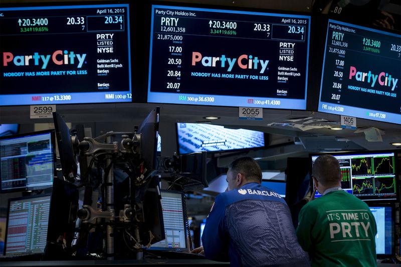 © Reuters. FILE PHOTO: A Barclay's Capital Specialist trader  works at the post that trades Party City Holdco Inc.  during the company's IPO on the floor of the New York Stock Exchange April 16, 2015. REUTERS/Brendan McDermid/File Photo