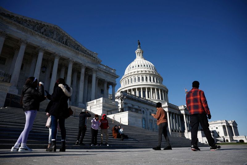 © Reuters. FILE PHOTO: People walk near the U.S. Capitol in Washington, D.C., U.S., December 2, 2024. REUTERS/Benoit Tessier/File Photo