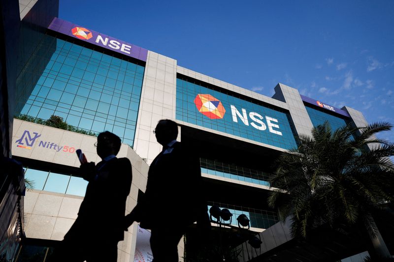 © Reuters. FILE PHOTO: People walk outside the National Stock Exchange (NSE) in Mumbai, India, October 22, 2024. REUTERS/Francis Mascarenhas/File Photo