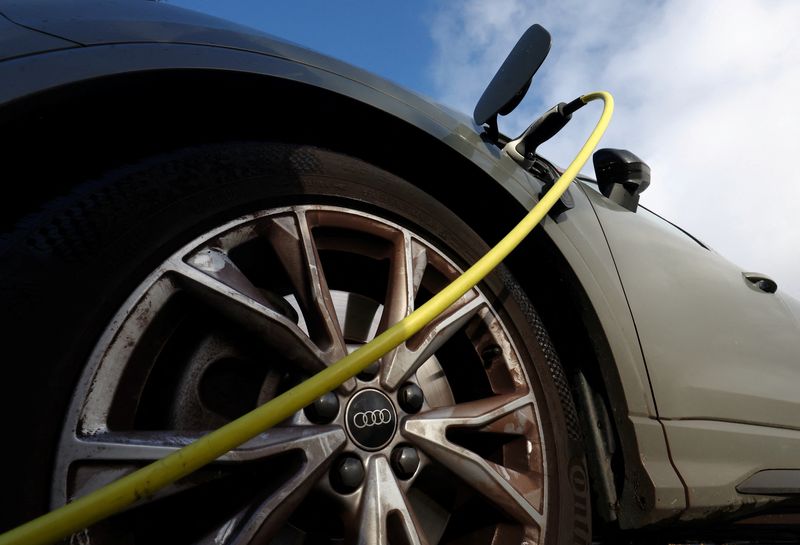 © Reuters. FILE PHOTO: An Audi electric vehicle is being charged in a charging station in Drogenbos, Belgium November 25, 2023. REUTERS/Yves Herman/File Photo