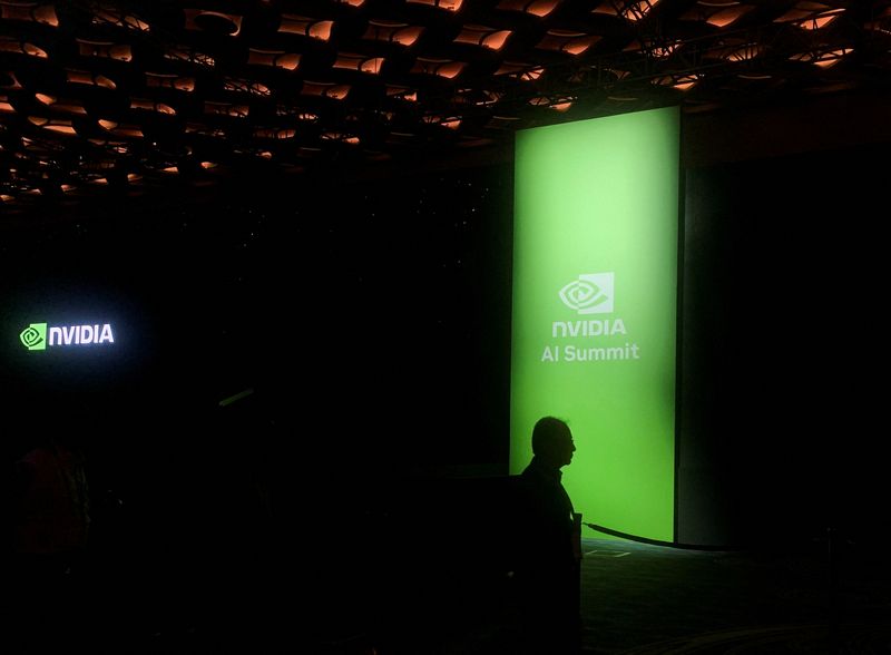 © Reuters. FILE PHOTO: A man walks past the Nvidia logo at the company's AI Summit in Mumbai, India, October 24, 2024. REUTERS/Arsheeya Bajwa/File Photo