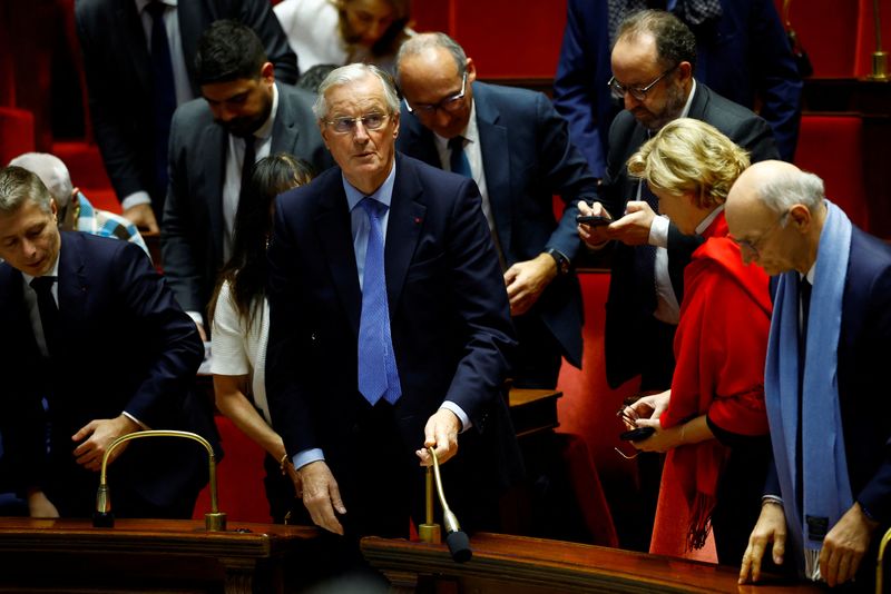 © Reuters. French Prime Minister Michel Barnier reacts after the result of the vote on the first motion of no-confidence against the French government, tabled by the alliance of left-wing parties the