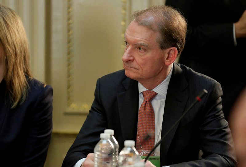 © Reuters. FILE PHOTO: CEO of Patomak Global Partners LLC Paul Atkins takes part in a strategic and policy CEO discussion with U.S. President Donald Trump in the Eisenhower Execution Office Building in Washington, U.S., April 11, 2017.  REUTERS/Joshua Roberts/File Photo