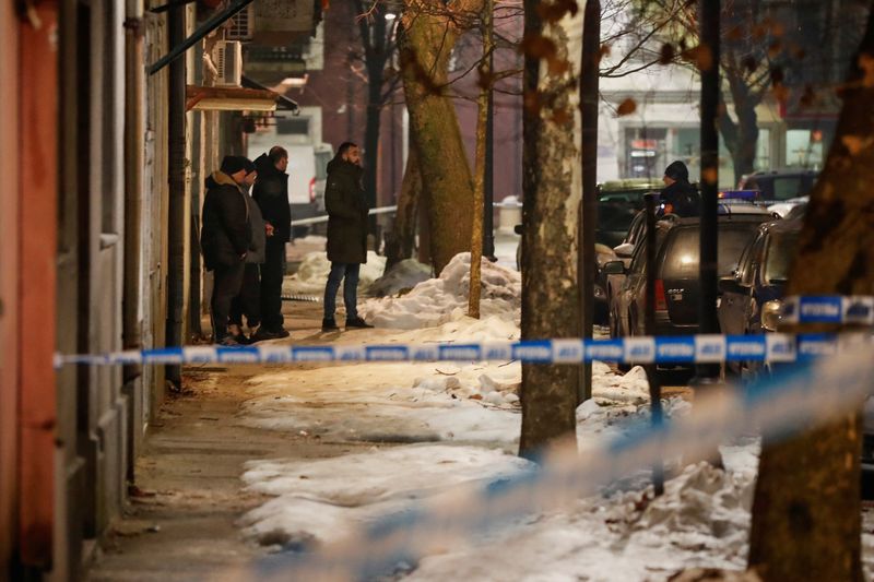 © Reuters. Police and security personnel stand on a street in front of a firetruck near the scene where a gunman opened fire at a restaurant and killed several people in Cetinje, Montenegro, January 1, 2025. REUTERS/Stevo Vasiljevic