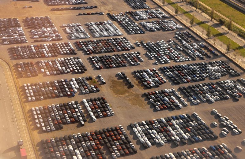 © Reuters. FILE PHOTO: An aerial view shows new vehicles parked at the port in Barcelona, Spain, December 7, 2024. REUTERS/Jon Nazca/File Photo