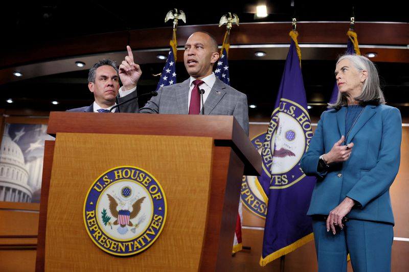 © Reuters. FILE PHOTO: U.S. House Minority Leader Hakeem Jeffries speaks to members of the news media along with U.S. House Democratic Whip Katherine Clark and House Democratic Caucus Chair Pete Aguilar (D-CA) after President-elect Donald Trump called on lawmakers to reject a stopgap bill to keep the government funded past Friday, raising the likelihood of a partial shutdown, on Capitol Hill in Washington, U.S., December 19, 2024. REUTERS/Leah Millis/File Photo