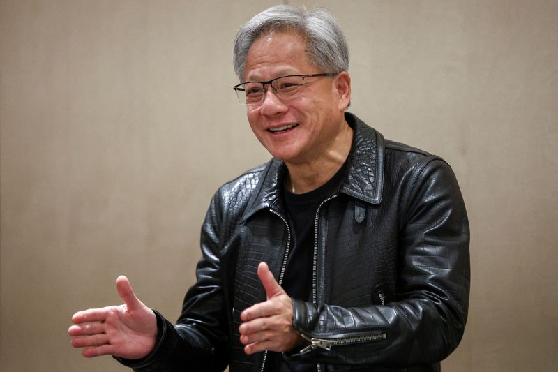 © Reuters. FILE PHOTO: NVIDIA CEO Jensen Huang speaks to the media during a press conference during the