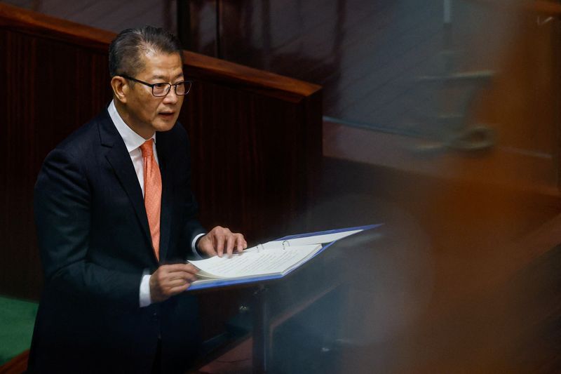 © Reuters. FILE PHOTO: Hong Kong's Finance Secretary Paul Chan delivers the annual budget address at the Legislative Council in Hong Kong, China Feburary 28, 2024. REUTERS/Tyrone Siu/File Photo