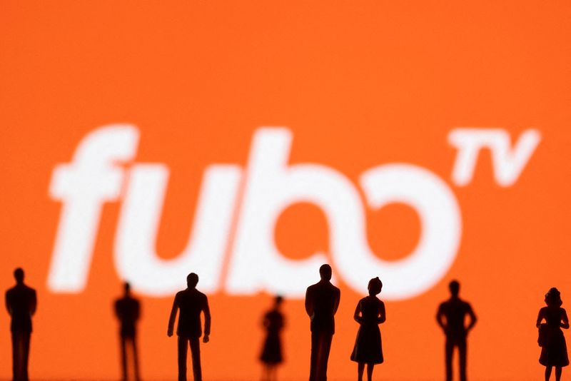 © Reuters. FILE PHOTO: Toy figures of people are seen in front of the displayed Fubo TV logo, in this illustration taken January 20, 2022. REUTERS/Dado Ruvic/Illustration/File Photo