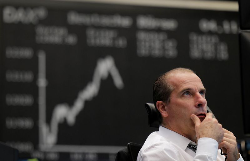 © Reuters. FILE PHOTO: A stock trader looks at his monitors at the stock exchange in Frankfurt, Germany, November 4, 2020, REUTERS/Kai Pfaffenbach/ File Photo