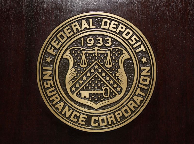 © Reuters. FILE PHOTO: The Federal Deposit Insurance Corp (FDIC) logo is seen at the FDIC headquarters as Chairman Sheila Bair announces the bank and thrift industry earnings for the fourth quarter 2010, in Washington, February 23, 2011.   REUTERS/Jason Reed/File Photo