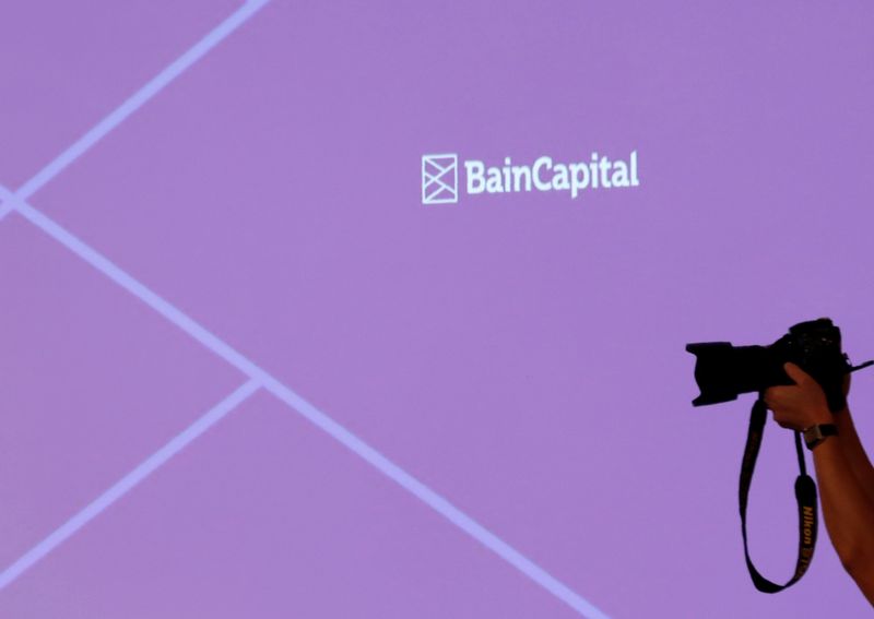 © Reuters. The logo of Bain Capital is displayed on the screen during a news conference in Tokyo, Japan October 5, 2017. REUTERS/Kim Kyung-Hoon/File Photo