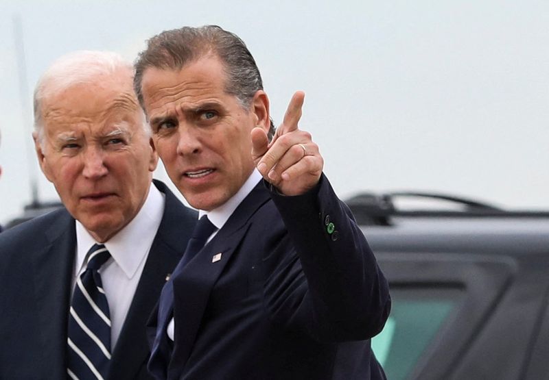 © Reuters. FILE PHOTO: U.S. President Joe Biden stands with his son Hunter Biden, who earlier in the day was found guilty on all three counts in his criminal gun charges trial, after President Biden arrived at the Delaware Air National Guard Base in New Castle, Delaware, U.S., June 11, 2024. REUTERS/Anna Rose Layden/File Photo