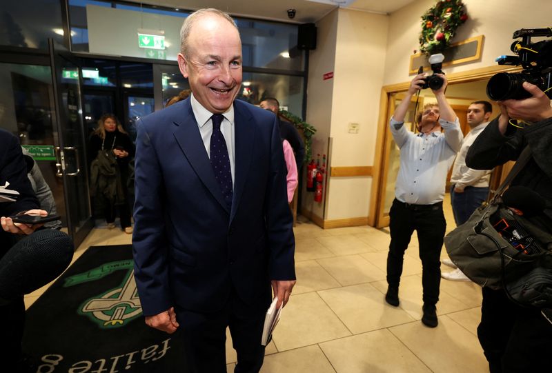 © Reuters. FILE PHOTO: Ireland's Tanaiste (Deputy Prime Minister) and leader of Fianna Fail, Micheal Martin smiles as he arrives at the Cork South Central count centre, during Ireland's general election, in Cork, Ireland, November 30, 2024. REUTERS/Damien Eagers/File Photo