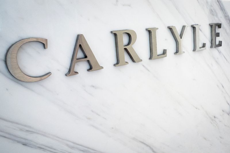 © Reuters. FILE PHOTO: The logo for Carlyle is seen at the company’s offices in New York City, U.S., June 28, 2022. Picture taken June 28, 2022. REUTERS/Brendan McDermid/File Photo