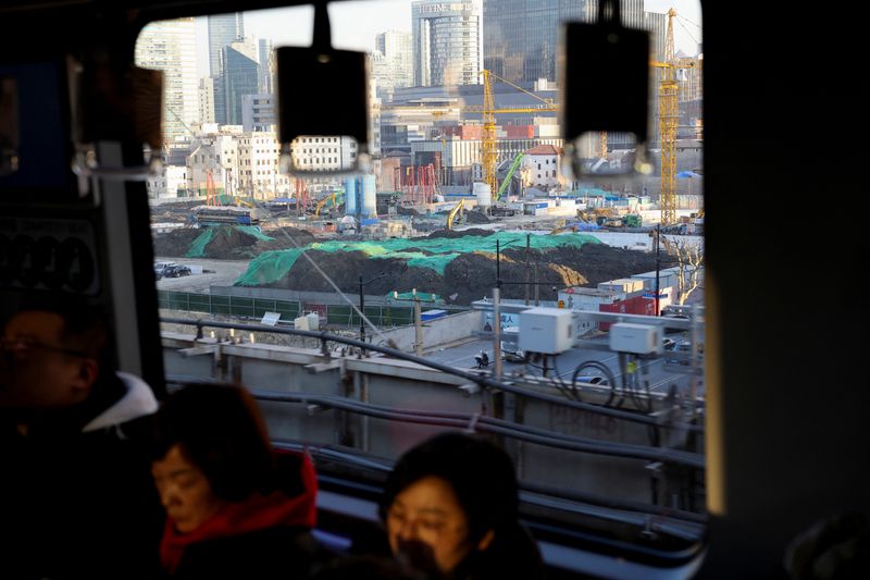 © Reuters. A construction site is seen as people ride a metro train in Shanghai, China, January 16, 2025.  REUTERS/Go Nakamura