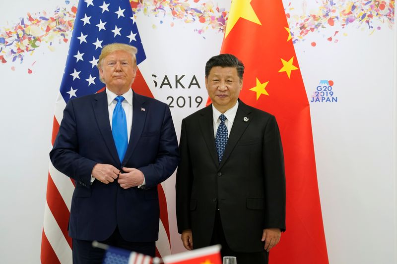 © Reuters. FILE PHOTO: U.S. President Donald Trump poses for a photo with China's President Xi Jinping before their bilateral meeting during the G20 leaders summit in Osaka, Japan, June 29, 2019. REUTERS/Kevin Lamarque/File photo