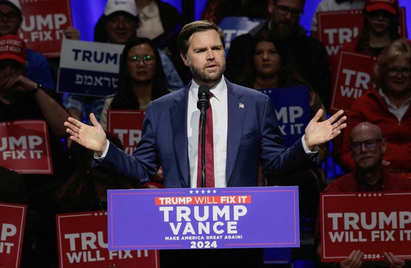 © Reuters. FILE PHOTO: Republican vice presidential nominee JD Vance speaks to supporters during a campaign stop at the Capitol Theatre in Flint, Michigan, U.S. November 4, 2024.  REUTERS/Rebecca Cook/File Photo