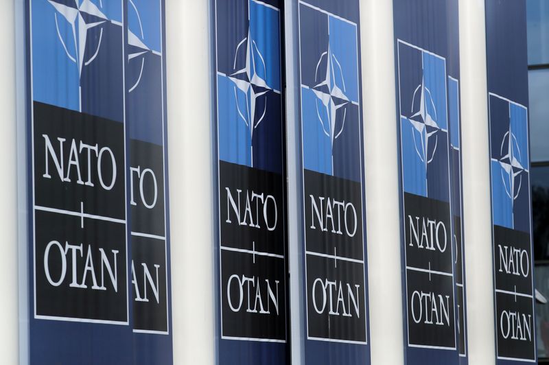 © Reuters. FILE PHOTO: NATO logos are seen at the Alliance headquarters ahead of a NATO Defence Ministers meeting, in Brussels, Belgium, October 21, 2021. REUTERS/Pascal Rossignol/File Photo