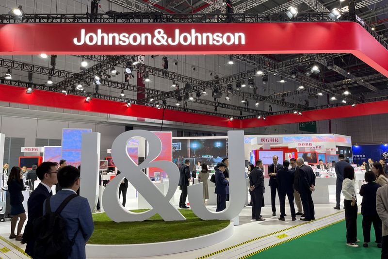 © Reuters. FILE PHOTO: People visit the booth of Johnson & Johnson at the China International Import Expo (CIIE) in Shanghai, China November 7, 2024. REUTERS/Andrew Silver/File Photo