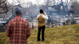 People look over the remains of homes damaged by the Marshall Fire in Louisville, Colorado, U.S. December 31, 2021.