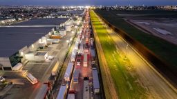 Aerial view of cargo trucks heading towards US at the Otay Commercial crossing in Tijuana, Baja California state, Mexico on March 27, 2025.